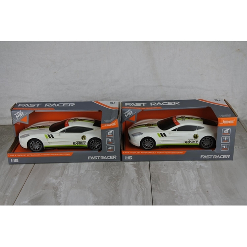 691 - Two boxed Fast Racer toy cars scale 1:16.