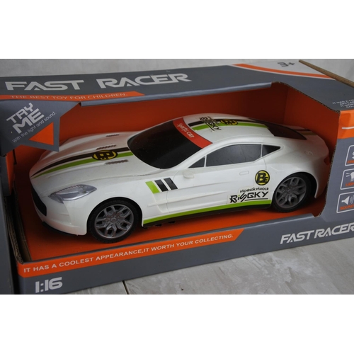 691 - Two boxed Fast Racer toy cars scale 1:16.