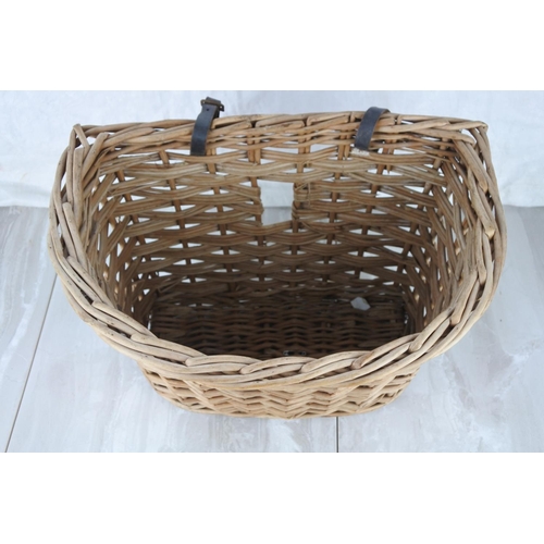 713 - A vintage wicker bicycle basket.