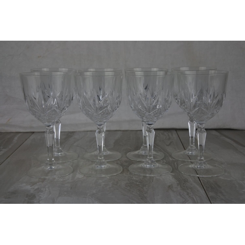 715 - A set of eight wine glasses.