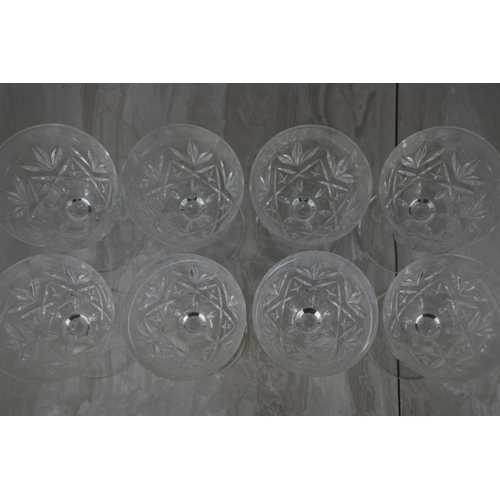 715 - A set of eight wine glasses.