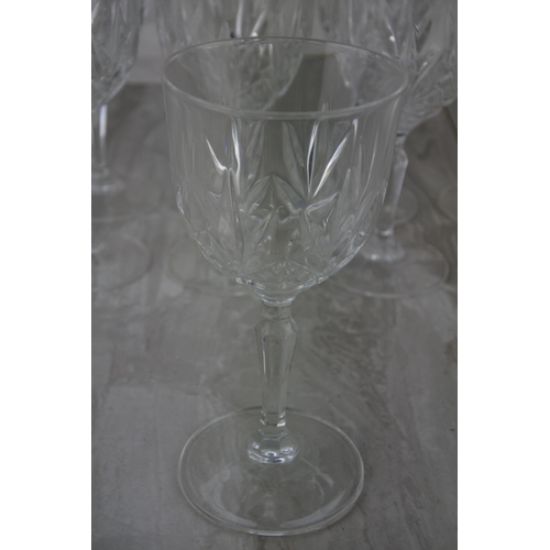 715 - A set of eight wine glasses.