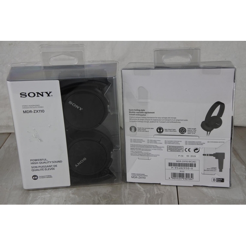 718 - Two boxed Sony MDR-ZX110 headphones.