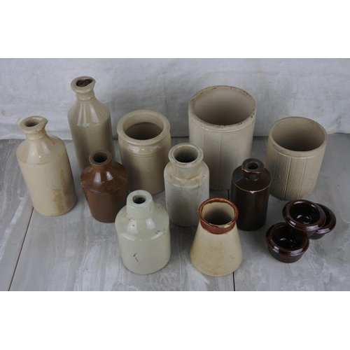 722 - A lot of antique stoneware bottles and jars.