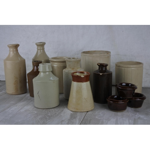 722 - A lot of antique stoneware bottles and jars.