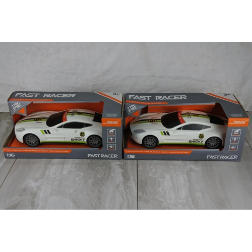 723 - Two boxed Fast Racer toy cars scale 1:16.