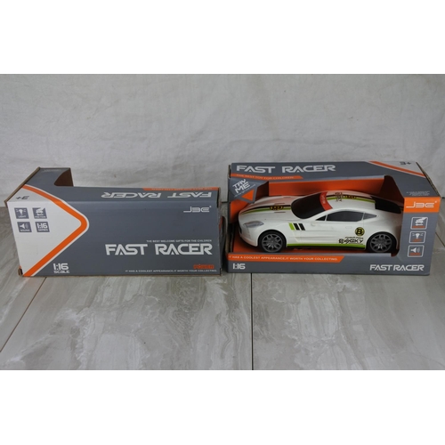 723 - Two boxed Fast Racer toy cars scale 1:16.