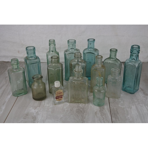 A lot of antique and vintage glass bottles to include Whitaker & Co ...