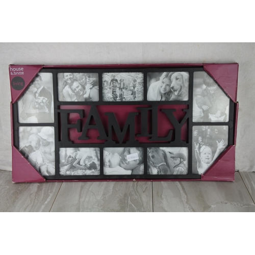 728 - A boxed 'Family' photograph frame.