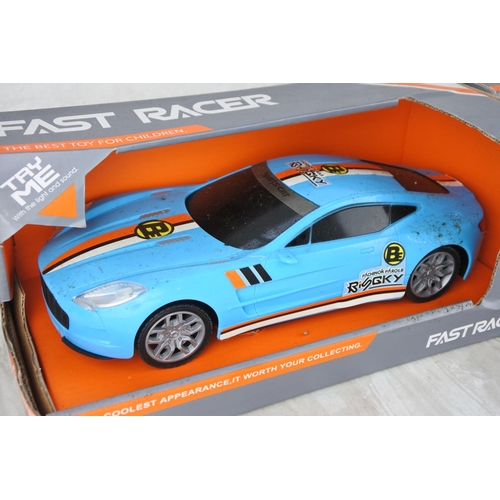 734 - Two boxed Fast Racer toy cars scale 1:16.