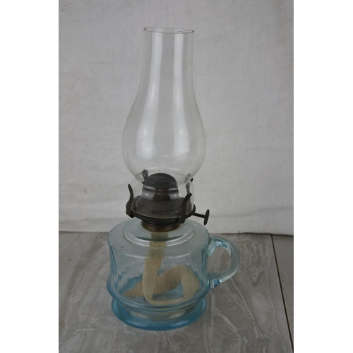 736 - A vintage glass finger lamp.