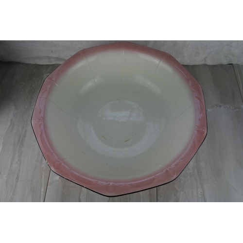 737 - An antique pottery jug and basin set.