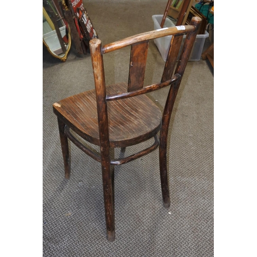 741 - A vintage wooden chair.