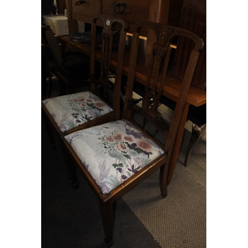 747 - A stunning pair of antique mahogany hall chairs with inlay detail.