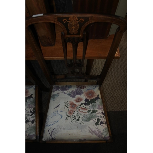 747 - A stunning pair of antique mahogany hall chairs with inlay detail.