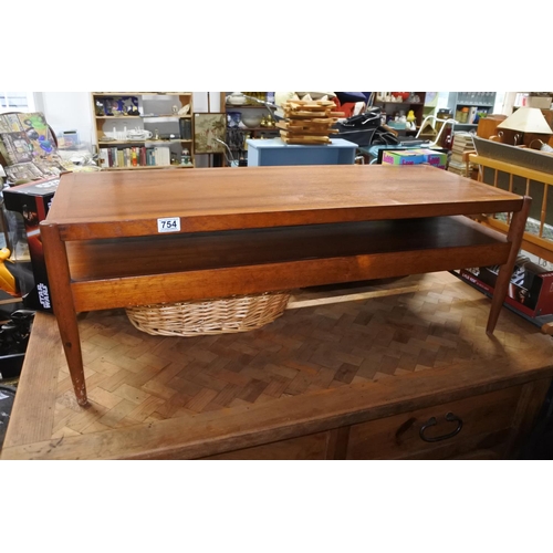 754 - A stunning mid century Danish coffee table/upholstered bench with storage undershelf.