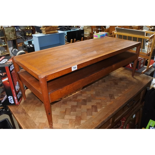 754 - A stunning mid century Danish coffee table/upholstered bench with storage undershelf.