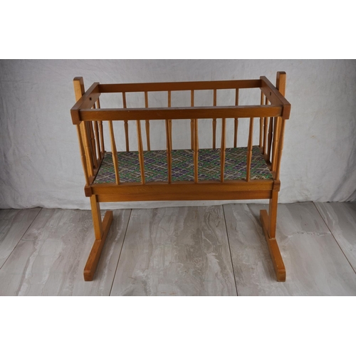 759 - A doll's wooden cradle. approx 46x48cm.