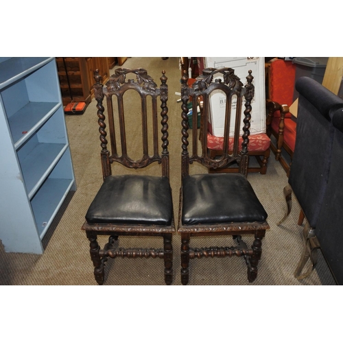 763 - A pair of antique barley twist oak chairs.