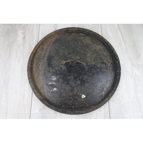 764 - An antique pot lid. approx 38cm.