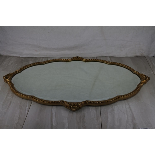 771 - A stunning gilt framed wall mirror. approx 73x47cm.