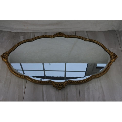 771 - A stunning gilt framed wall mirror. approx 73x47cm.