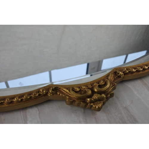 771 - A stunning gilt framed wall mirror. approx 73x47cm.