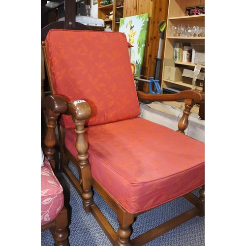 776 - An upholstered armchair with loose cushions.