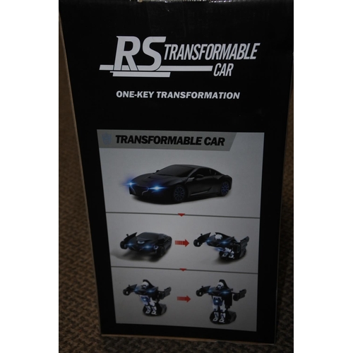 778 - A boxed Rastar RS Transformable car.