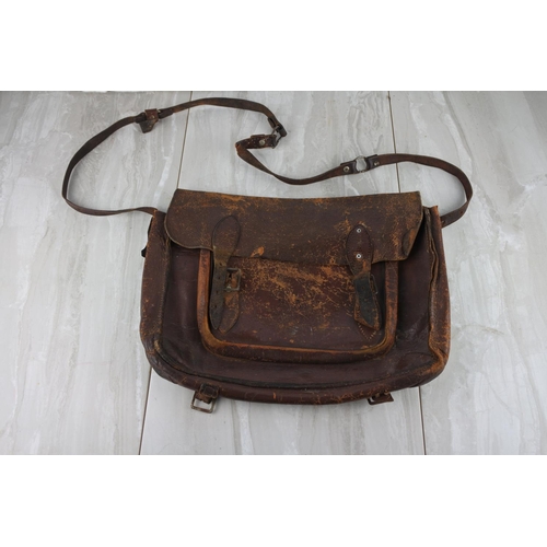 779 - A vintage leather satchel embossed E.A.H.