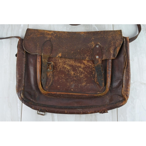 779 - A vintage leather satchel embossed E.A.H.