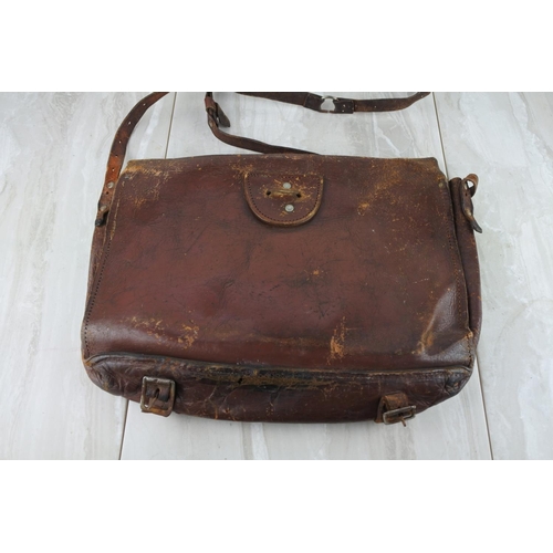 779 - A vintage leather satchel embossed E.A.H.