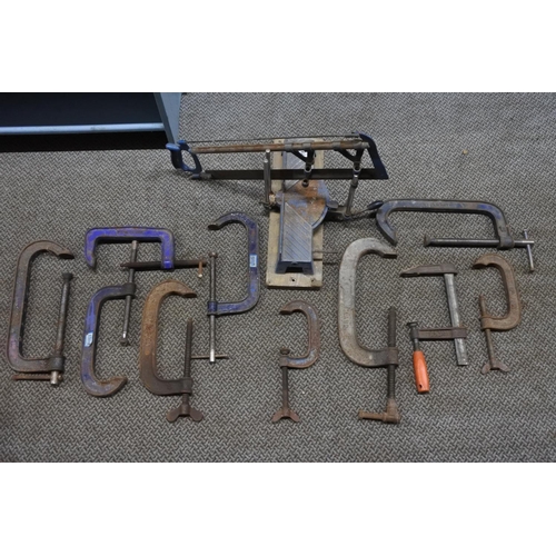 781 - A job lot of tools to include a Malleable wood clamp no 10, an angle saw and more.