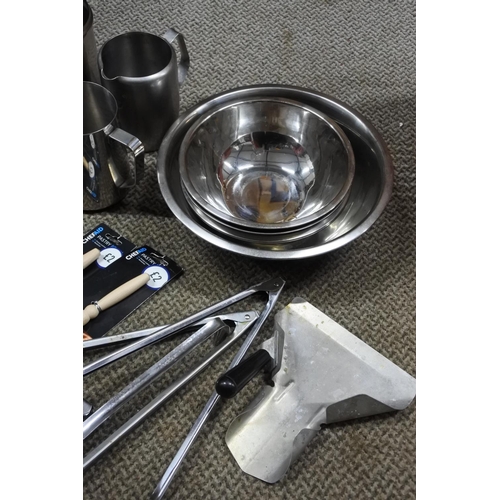 798 - A large lot of kitchen utensils, stainless steel bowls and more.