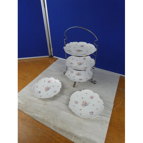 806 - A vintage three tier silver plated cake stand and two extra plates.