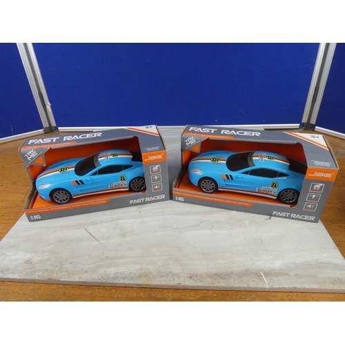 817 - Two boxed Fast Racer toy cars scale 1:16.