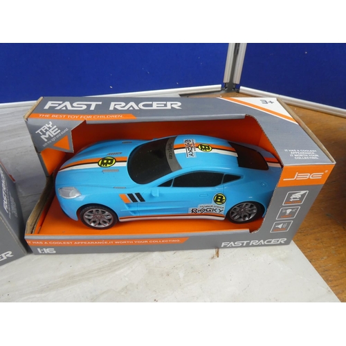 817 - Two boxed Fast Racer toy cars scale 1:16.