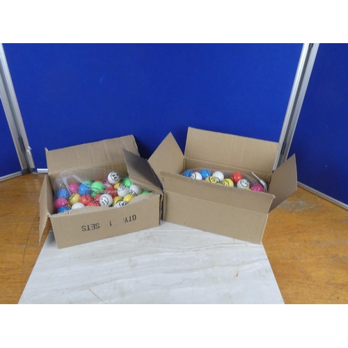 822 - Two boxes of bingo balls.