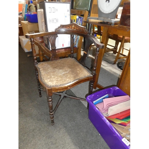 841 - An antique mahogany corner chair with inlay detail.