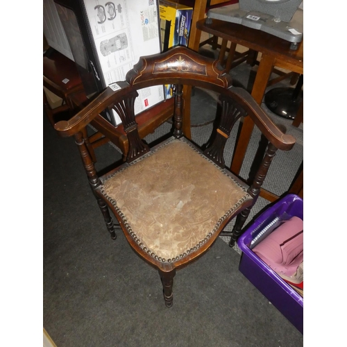 841 - An antique mahogany corner chair with inlay detail.