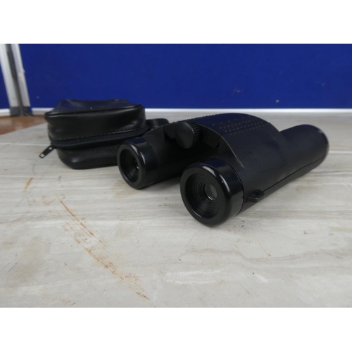 899 - A pair of Source binocular and case.