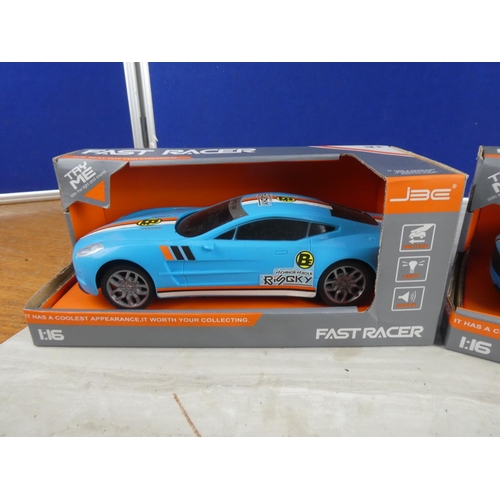 817 - Two boxed Fast Racer toy cars scale 1:16.