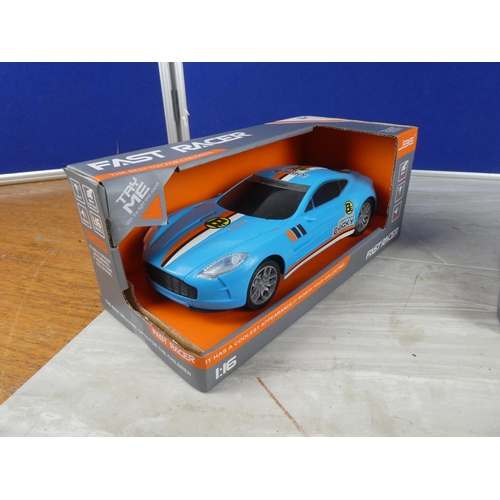 817 - Two boxed Fast Racer toy cars scale 1:16.