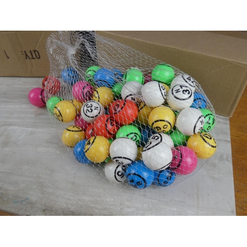 822 - Two boxes of bingo balls.