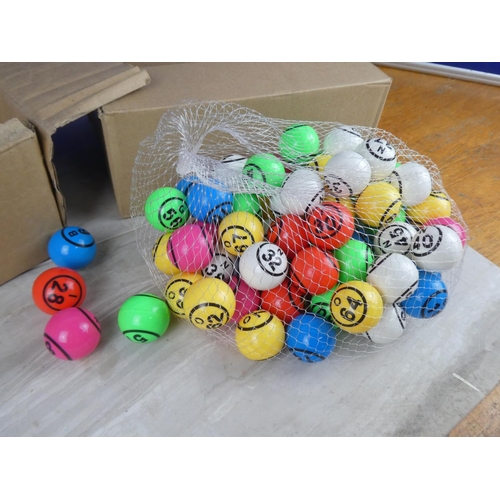 822 - Two boxes of bingo balls.