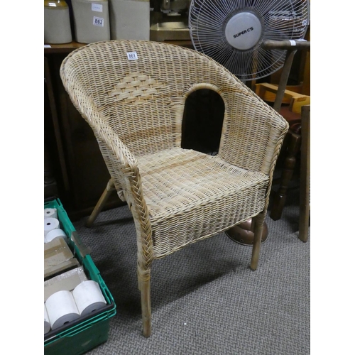 861 - A vintage rattan armchair.