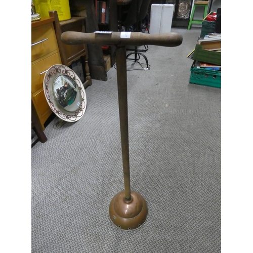 867 - An antique copper plunger. approx 83cm.