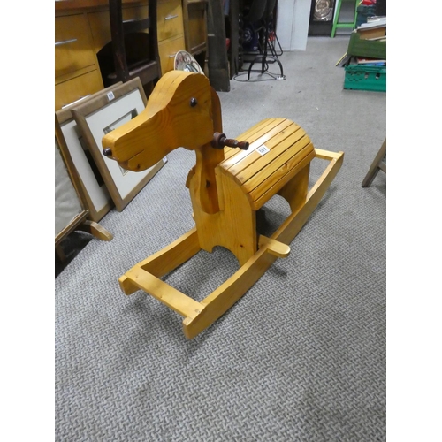 869 - A child's wooden rocking horse. approx 97x62cm.