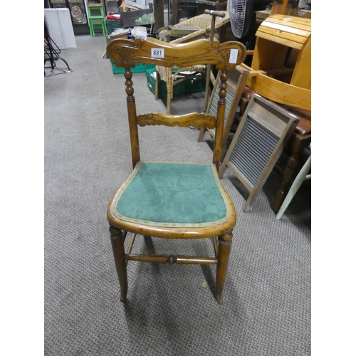 881 - An oak carved back bedroom chair.