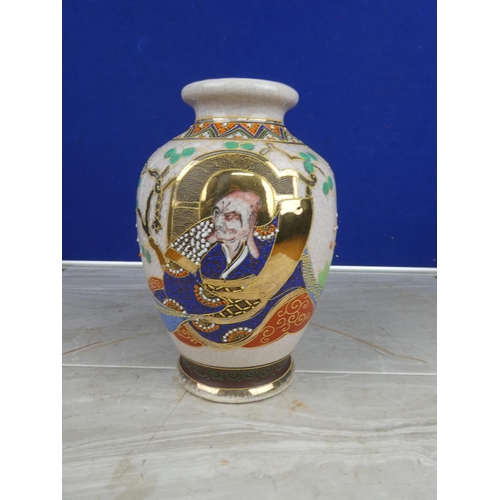 894 - An oriental style vase with hand painted detail.